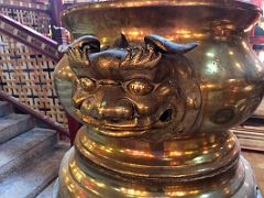 05E Incense gold urn cauldron with a lion head detail in Man Mo Temple Hong Kong